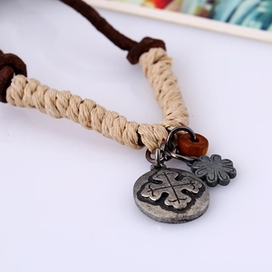 Vintage braided leather necklace with cross-emblem medal and dark wooden bead