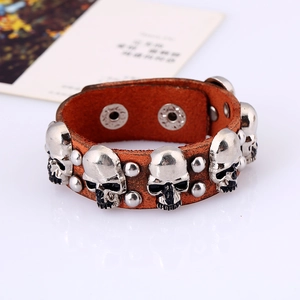 Retro punk brown leather bracelet for men featuring metallic skulls and rivet accents