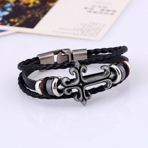 Retro multi-layer braided leather bracelet featuring a gothic silver cross and magnetic clasp