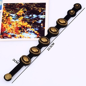 Retro black leather punk bracelet with five bronze rivets and adjustable snaps