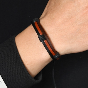 Handmade woven vintage leather bracelet for men featuring multilayered black and brown straps
