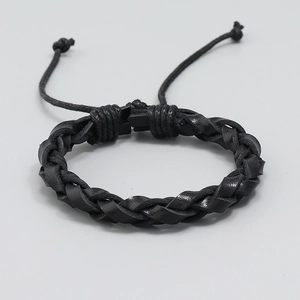 Minimalist black braided leather bracelet featuring multi-strand weave and adjustable cord