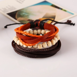 Multilayer braided leather bracelet set with orange ropes and wooden beads on white surface