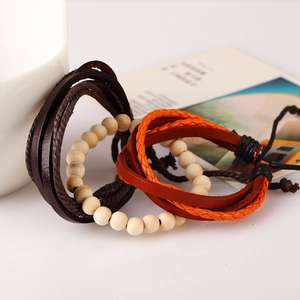 Retro multi-layer leather bracelet set with woven straps and natural wooden beads