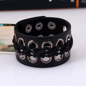 Punk style wide black leather bracelet for men featuring metal eyelets and snap buttons