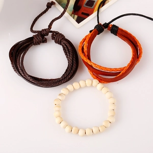 Retro multi-layer woven leather bracelet set with brown cords and cream wooden beads