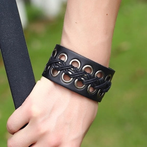 Men's wide black leather punk bracelet with silver metal eyelets and woven cord details
