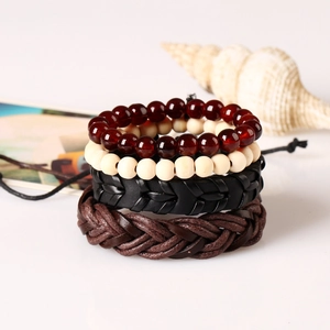 Retro multi-layer woven leather bracelet set with ethnic beads on white background