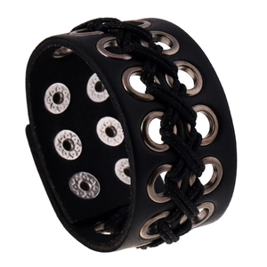 Detail view of adjustable black punk leather bracelet with metal eyelets and snap buttons