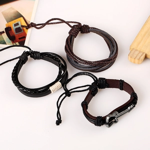 Retro multi-layer braided leather bracelet set featuring a vintage alloy guitar charm