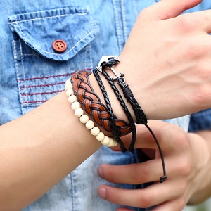 Multi-layer vintage nautical leather bracelet set with anchor charm on wrist
