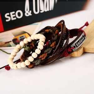Multilayer leather and beaded bracelet set featuring a vintage Believe metal plate