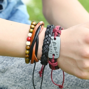 Bohemian multilayer leather bracelet set with Love plaque and wood beads on wrist