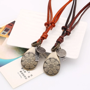 Retro hollow flower pendant necklace with adjustable leather cord for a vintage aesthetic