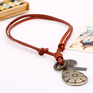 Long leather necklace with vintage bronze mandala pendant and adjustable cord