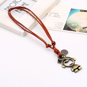 Retro brown leather rope necklace featuring a bronze cartoon pendant on white background