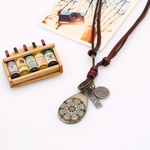Vintage bronze mandala pendant necklace with adjustable brown leather cord for women