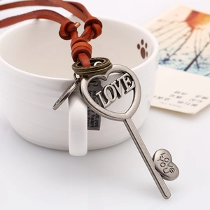 Vintage long leather cord necklace with heart-shaped LOVE key pendant in silver