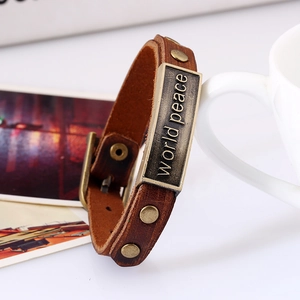 Vintage brown leather peace bracelet with world peace engraved metal plate and studs