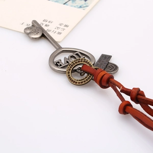Vintage leather cord necklace with large LOVE key pendant and bronze gear elements
