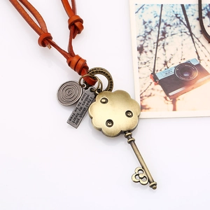Vintage leather cord necklace featuring hollow key and engraved bronze alloy charms