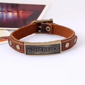 Vintage brown leather world peace bracelet with adjustable buckle and metal plate