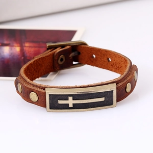 Vintage brown leather bracelet with bronze cross pendant and adjustable buckle strap
