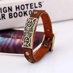 Retro brown leather bracelet featuring an engraved bronze metal cross totem charm for men