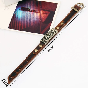 Vintage dark brown leather bracelet with embossed cross metal plate and buckle closure