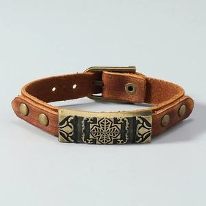 Vintage brown leather men's bracelet with bronze metal plate and cross engravings