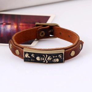 Vintage brown leather punk bracelet with bronze skull plaque and adjustable buckle