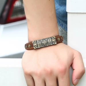 Men's retro brown leather bracelet featuring a cross engraved bronze metal plate