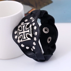 Punk style wide black leather bracelet with silver rivets and iron cross on white cup