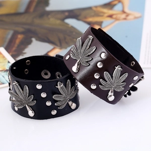 Punk leather bracelet with metal maple leaf charm and silver rivets in black and brown