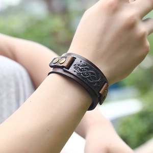 Vintage punk men's brown leather cuff bracelet featuring embossed Celtic patterns