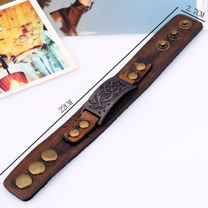 Vintage brown leather wristband for men with bronze tribal pattern and snap buttons