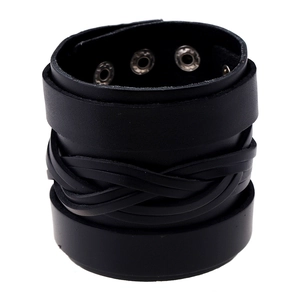 Detail view of black punk leather bracelet featuring woven layers and adjustable eyelet buckles