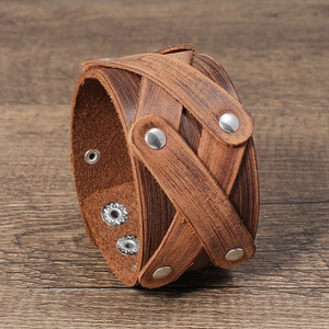 Vintage brown multi-layer wide leather wristband with silver studs and adjustable snaps