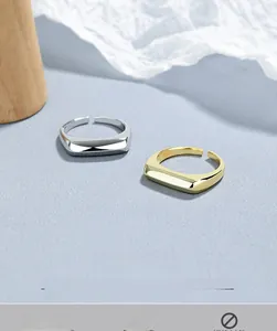 Macro shot of minimalist S925 sterling silver open rings in gold and silver finishes