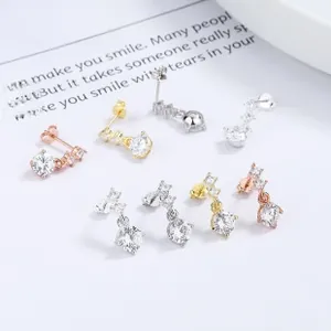 Detailed view of teardrop zircon stud earrings in silver, gold, and rose gold finishes