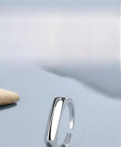 Close-up of polished S925 sterling silver open ring with high-gloss finish and plating