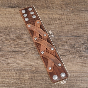 Detail of vintage brown leather punk bracelet with rivets showing 24cm length and 4cm width