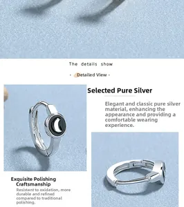 Makro-Detail von polierten 925 Sterling Silber Mond Ohrringen mit weißem Emaille-Finish