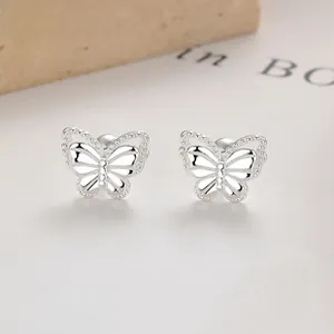 Detailed close-up of 925 silver butterfly earrings with hollow double-layered wings
