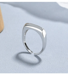 Macro shot of S925 sterling silver stamp on minimalist adjustable wide band ring