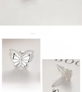 Macro shot of 925 sterling silver hollow butterfly earrings with polished finish details