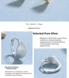 Macro shot of 925 sterling silver leaf earrings showing the brushed metal texture