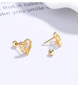 Detailed macro view of 925 silver heart stud earrings with starburst zircon and screw back