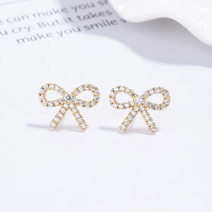 Élégantes boucles d'oreilles nœud en argent 925 doré avec pavé de zircons brillants