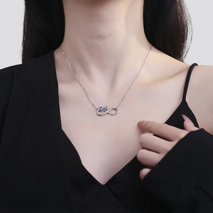 Elegant S925 silver infinity necklace featuring cat silhouettes and blue gemstones